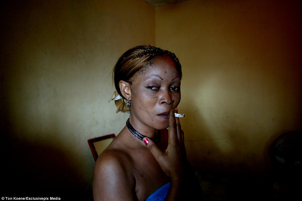 3CB8A86800000578-4179702-A_sex_worker_smokes_a_cigarette_in_the_series_of_photographs_tak-a-77_1485971146756